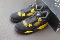 Air Jordan 4 Thunder Black / Yellow Sneakers